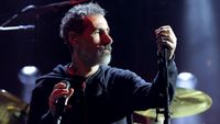 Serj Tankian onstage with System Of A Down in 2022