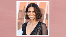 Halle Berry is pictured with a curly bob at the premiere of "The Union" held at The Egyptian Theatre Hollywood on August 12, 2024 in Los Angeles, California/ in a pink template