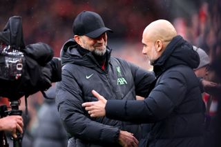 Jurgen Klopp greets Pep Guardiola ahead of a Premier League match between Liverpool and Manchester City in March 2024.