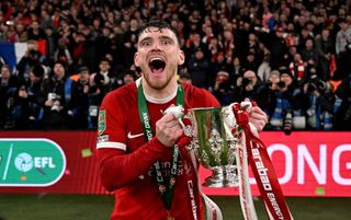 Andy Robertson of Liverpool with the Carabao Cup trophy at the end of the Carabao Cup Final between Chelsea and Liverpool at Wembley Stadium on February 25, 2024 in London, England.