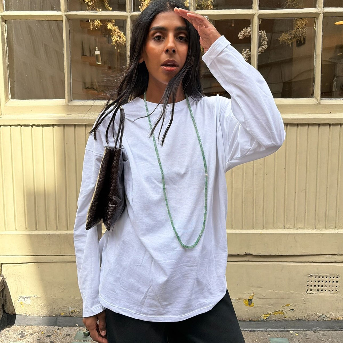 Woman in a long sleeve white top
