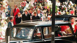 Earl Spencer, Diana's brother, is surrounded by Harry and William at Princess Diana's funeral