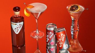 Promotional shot featuring cocktail glasses, cans and a bottle of Ghia