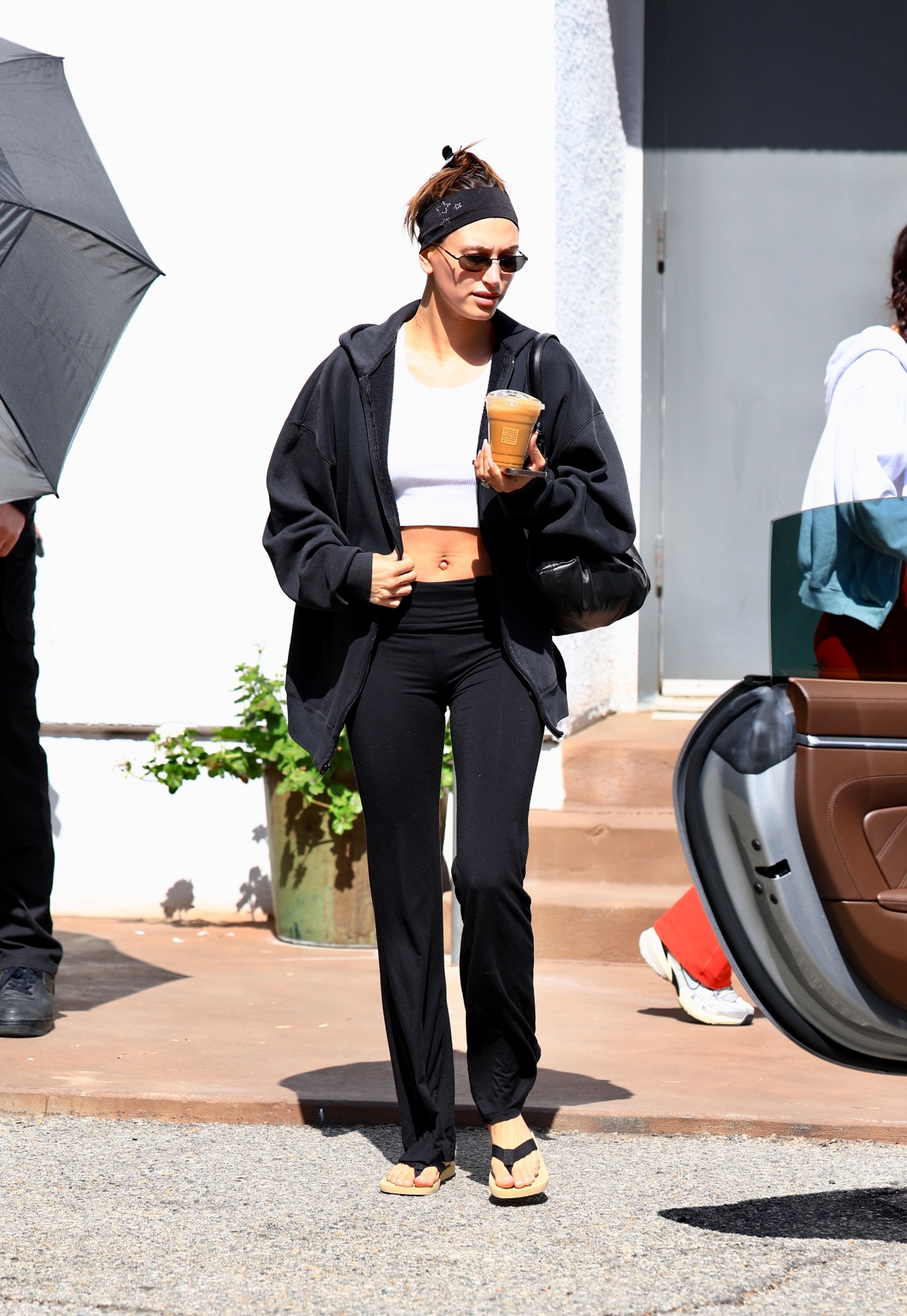 How to style Hailey Bieber's favorite flip-flops from The Row, A.Emery, Toteme, Massimo Dutti, and more