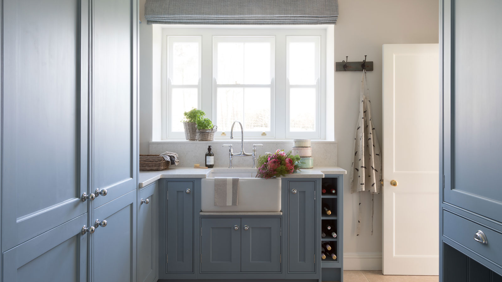 pale blue utility room with Belfast sink