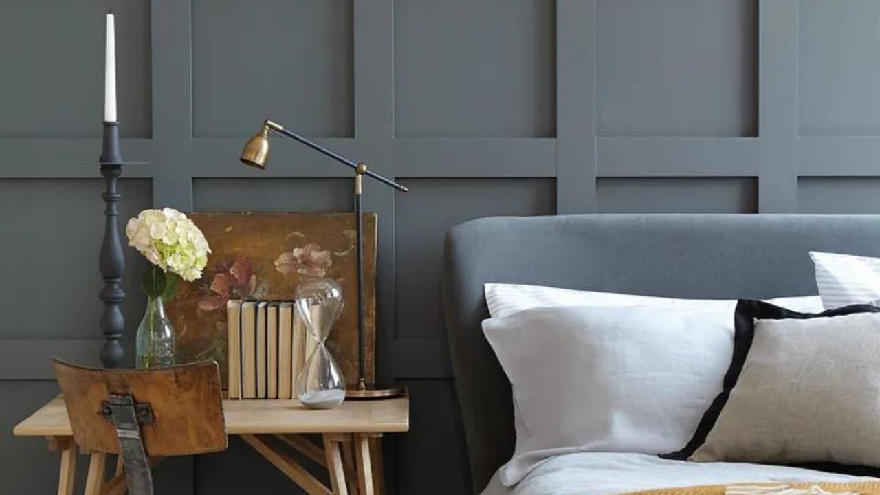 Bedroom with gray wall paneling