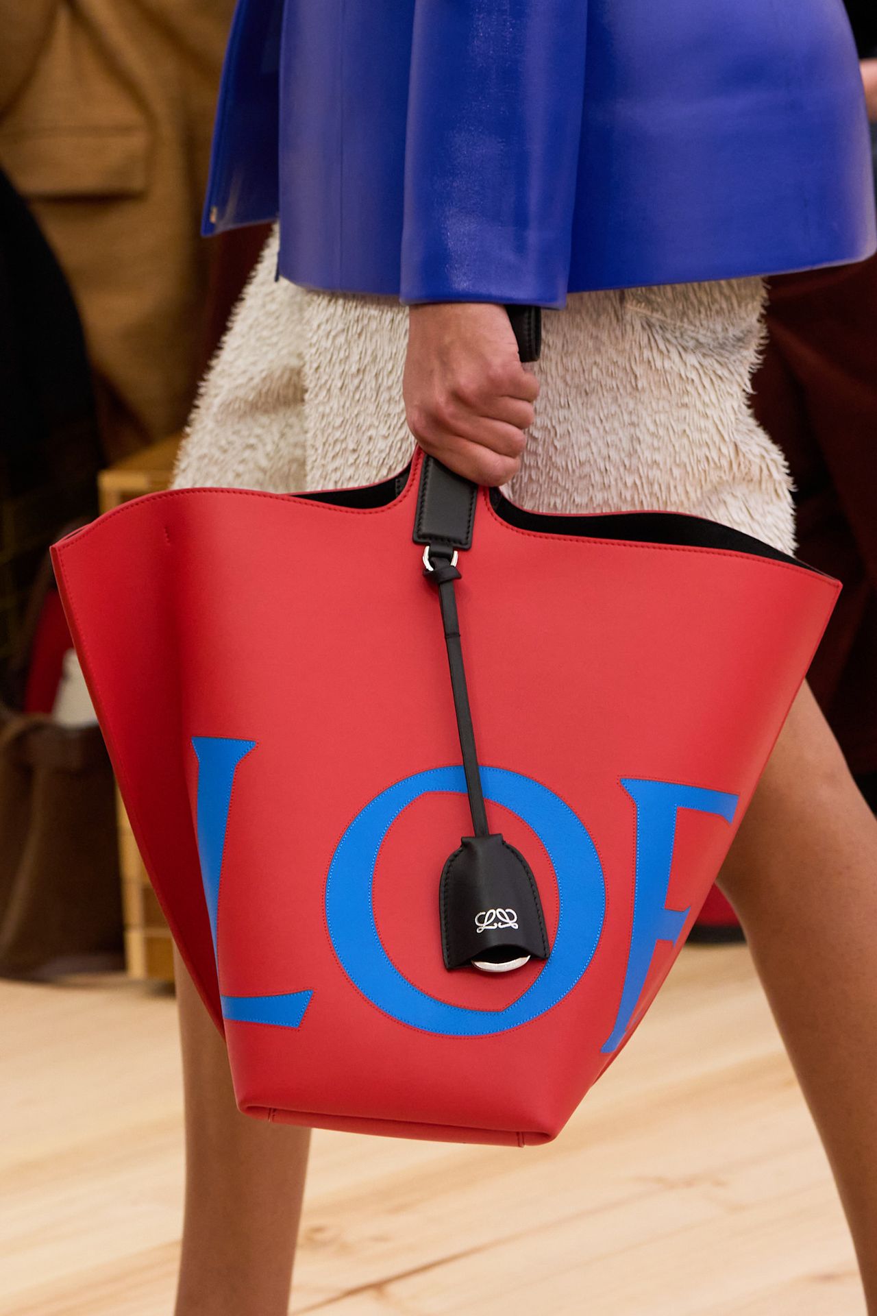 a red and blue logo leather tote bag on the spring 2026 loewe runway