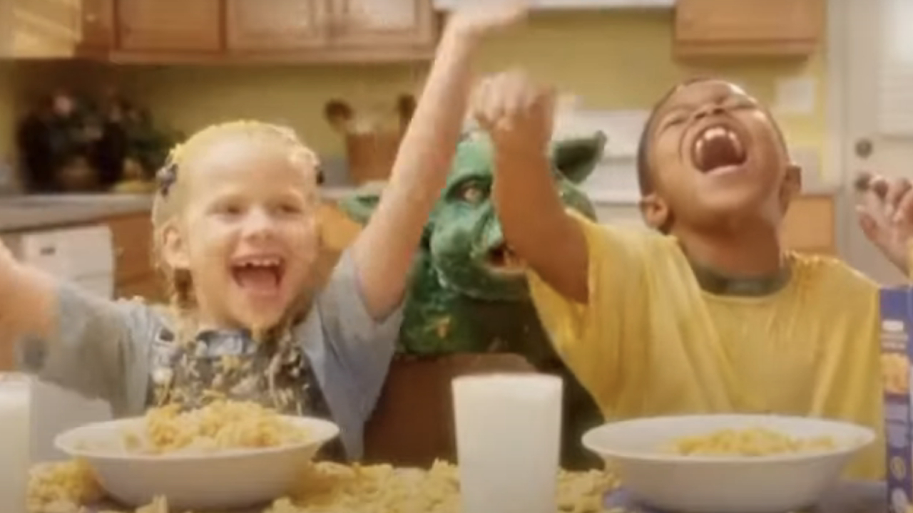 Kids covered in macaroni and cheese with Cheddar Goblin in Mandy