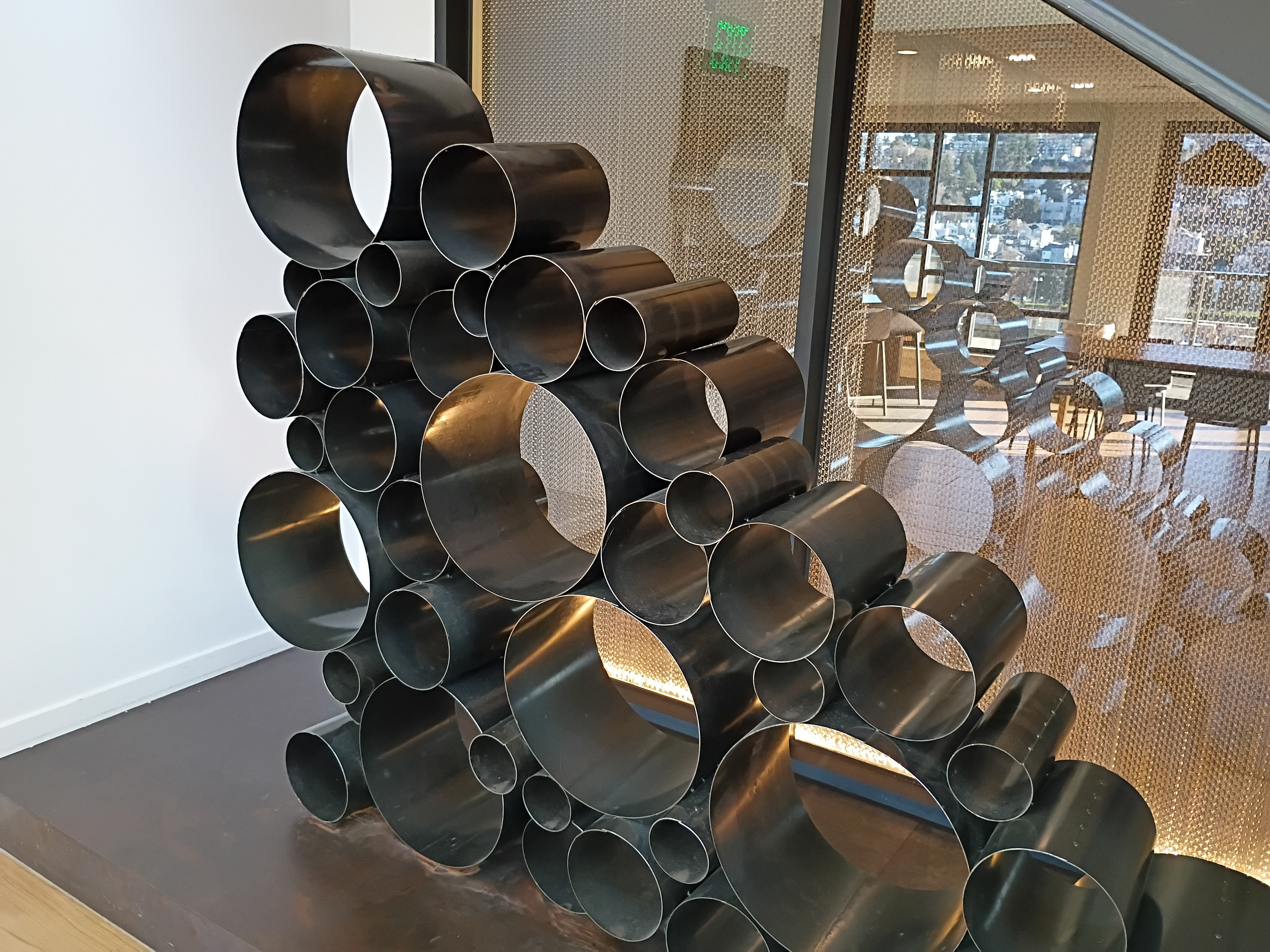 Many black cylinders stacked on top of each other