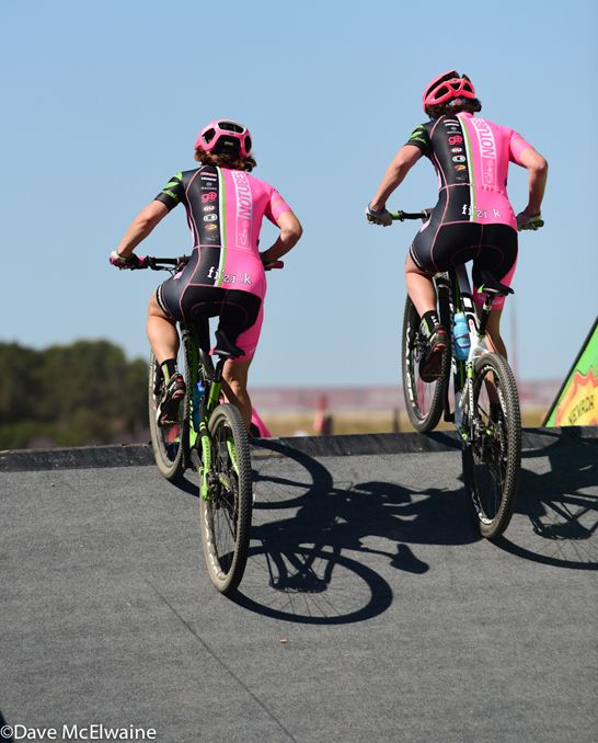 Two NoTubes riders cross the flyover together