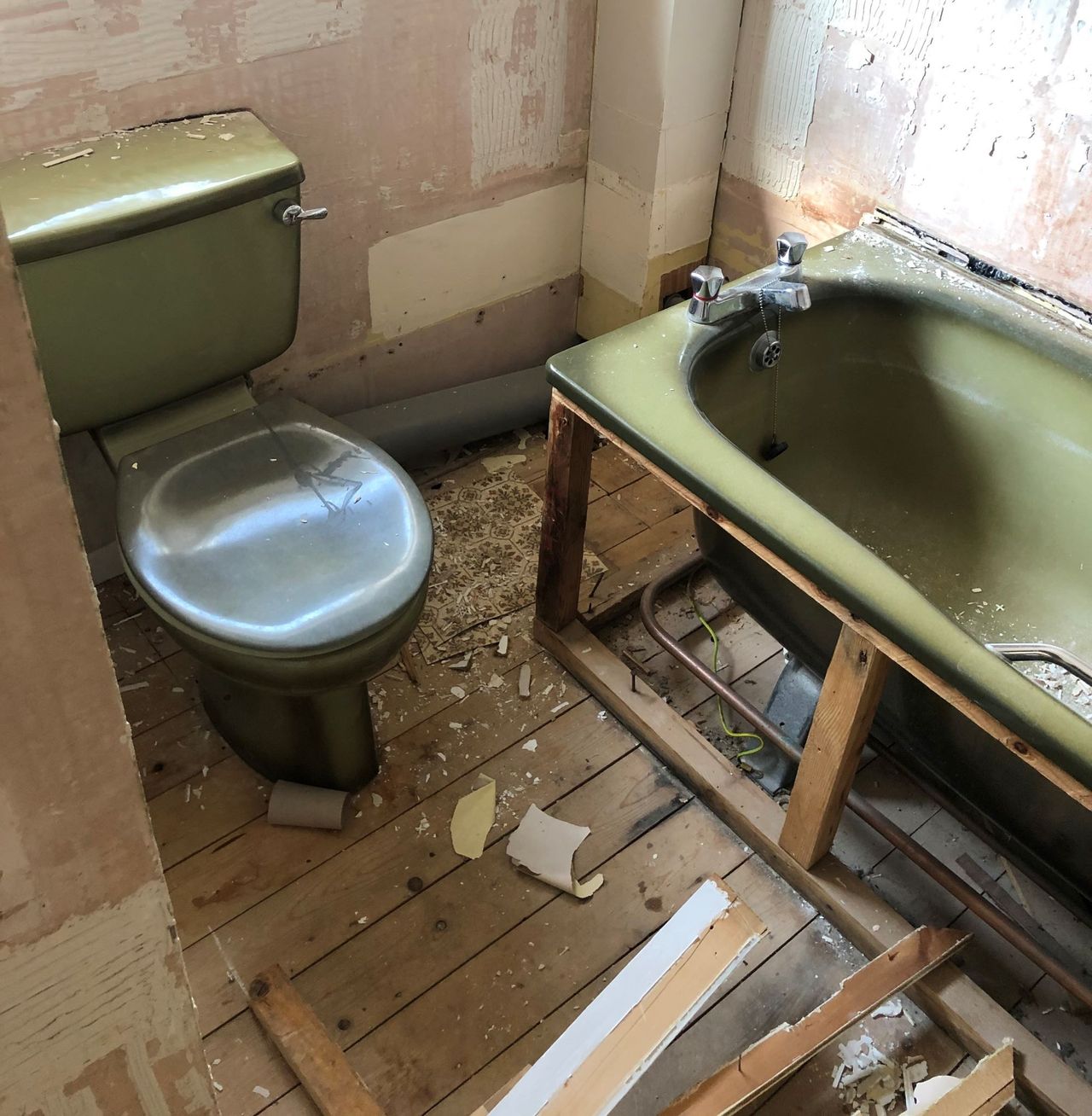 Avocado bathroom being ripped out