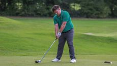 Golfer gets ready to hit a drive
