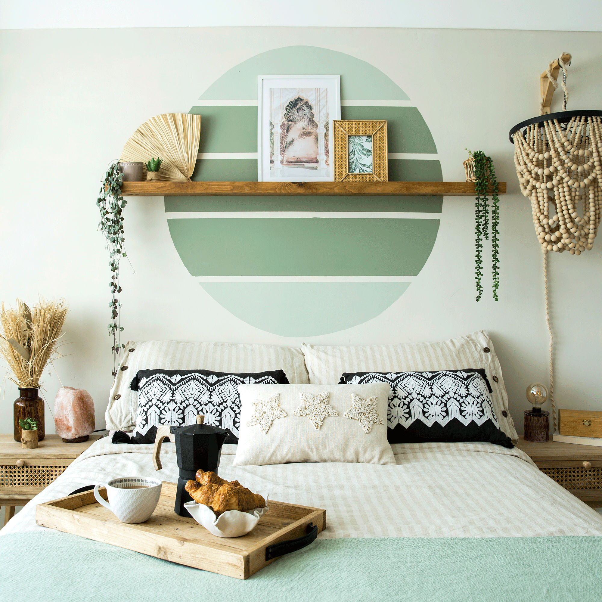 Green circle paint design above bed