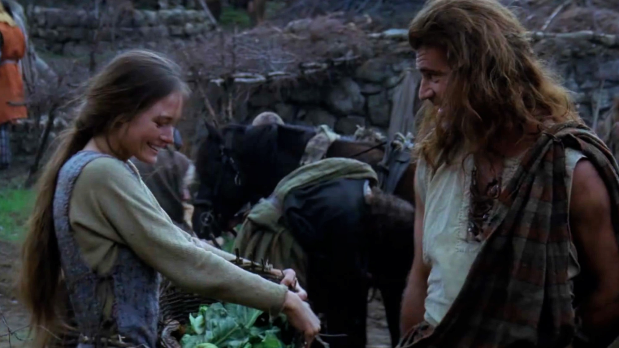 Catherine McCormack looking down and smiling as she speaks with Mel Gibson in Braveheart