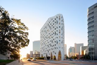 Popular hotel with an organically inspired facade and irregular openings