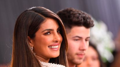 Indian actress Priyanka Chopra (L) and US singer-songwriter Nick Jonas arrive for the 62nd Annual Grammy Awards on January 26, 2020, in Los Angeles. (Photo by VALERIE MACON / AFP) (Photo by VALERIE MACON/AFP via Getty Images)