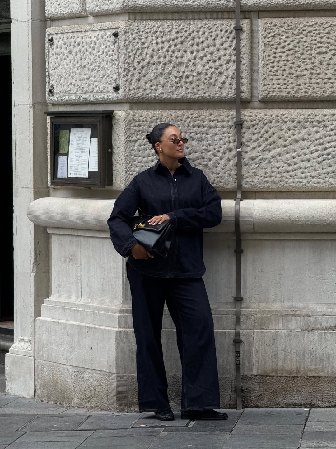 Influencer Tegan Frances wearing an indigo denim outfit.