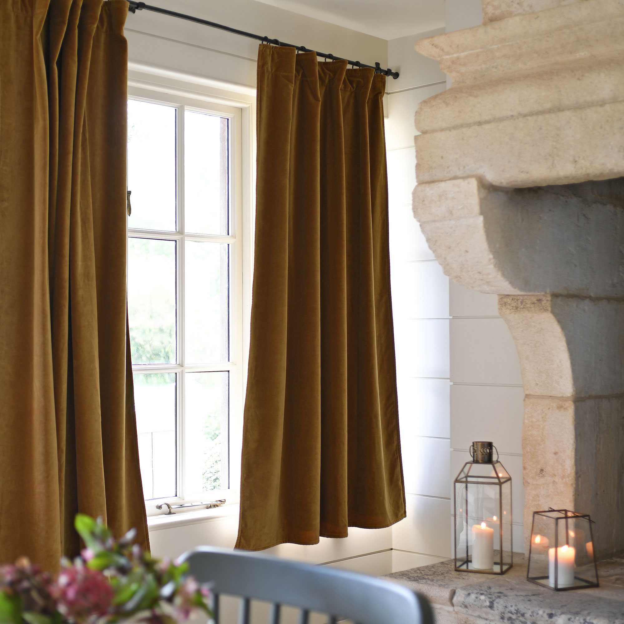 velvet mustard coloured curtains hanging in old house