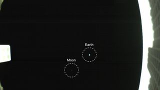 The Earth and moon star in this first photo from Wall-E, one of NASA's two Mars Cube One cubesats, that launched with the agency's InSight Mars lander on May 5, 2018. This view of Earth and the moon was taken May 9.