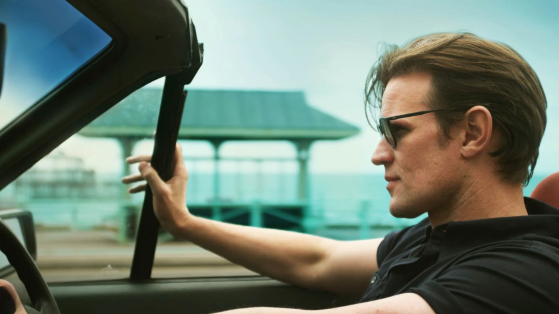 an image of matt smith driving a car in the series the death of bunny munro