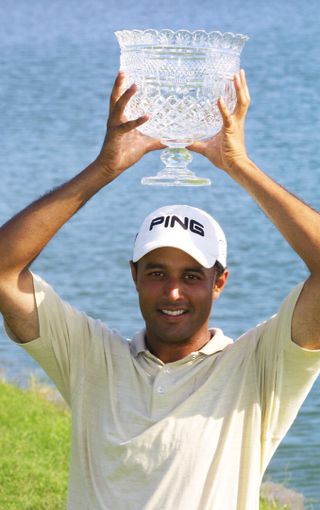 India's first tour winner - Arjun Atwal with the 2002 Caltex Masters trophy