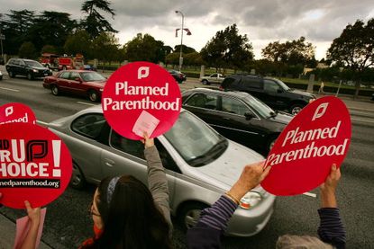 Planned Parenthood supporters rally on Roe v. Wade anniversary