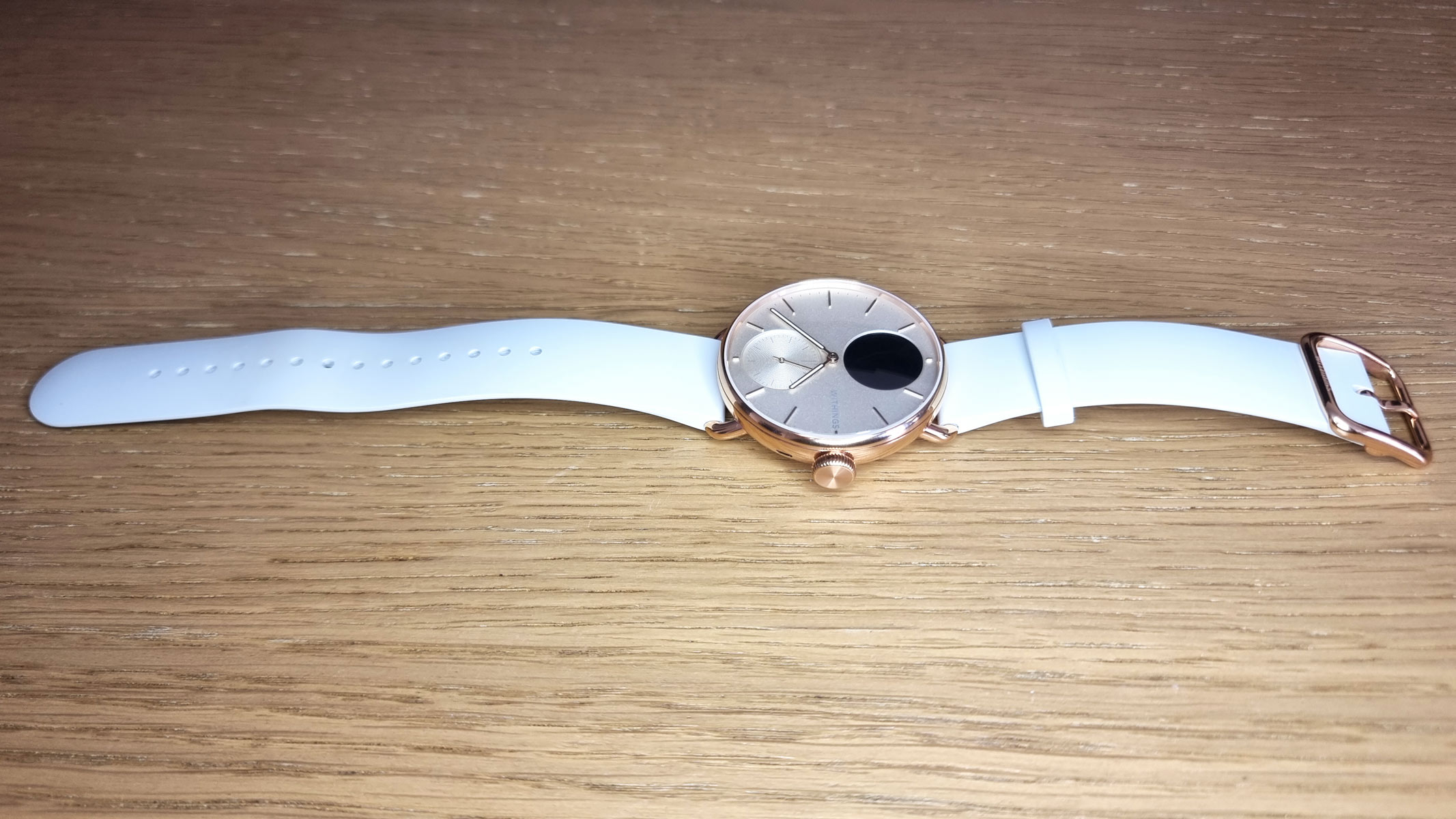 a picture of the Withings ScanWatch 2 laid out on the table