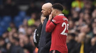 Manchester United's English striker Jadon Sancho (R) speaks with Manchester United's Dutch manager Erik ten Hag (L) during the English Premier League football match between Leeds United and Manchester United at Elland Road in Leeds, northern England on February 12, 2023