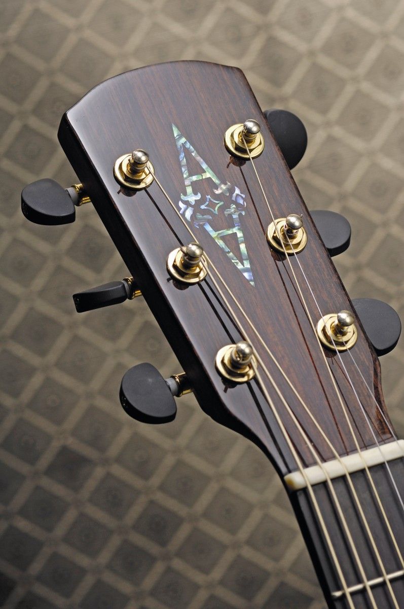 The headstock is adorned with subtle but high quality hardware
