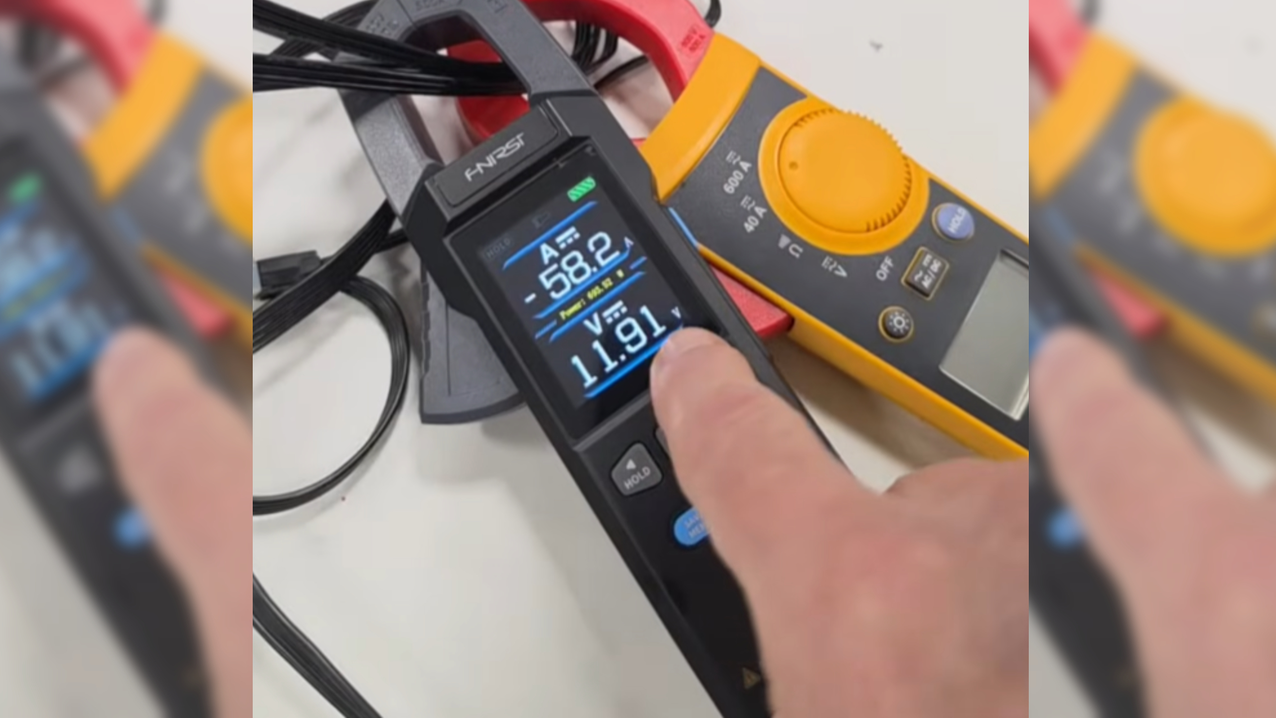 TecLab measuring the amps and voltage of an RTX 5090 running on 8-pin cables via a mod.