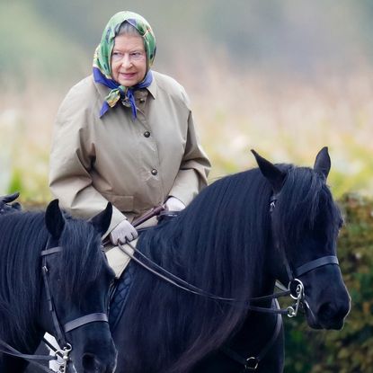 Queen Elizabeth II, accompanied by her Stud Groom Terry Pendry, seen horse riding in the grounds of Windsor Castle on October 18, 2008 