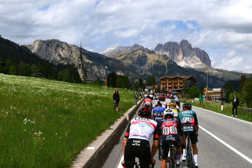 PASSO FEDAIA ITALY MAY 28 Alessandro Covi of Italy and UAE Team Emirates Edoardo Zardini of Italy and Team Drone Hopper Androni Giocattoli Sidermec Lennard Kmna of Germany and Team Bora Hansgrohe Mauri Vansevenant of Belgium and Team QuickStep Alpha Vinyl and a general view of the breakaway passing through Vigo di Fassa 1304m while fans cheer during the 105th Giro dItalia 2022 Stage 20 a 168km stage from Belluno to Marmolada Passo Fedaia 2052m Giro WorldTour on May 28 2022 in Passo Fedaia Italy Photo by Tim de WaeleGetty Images