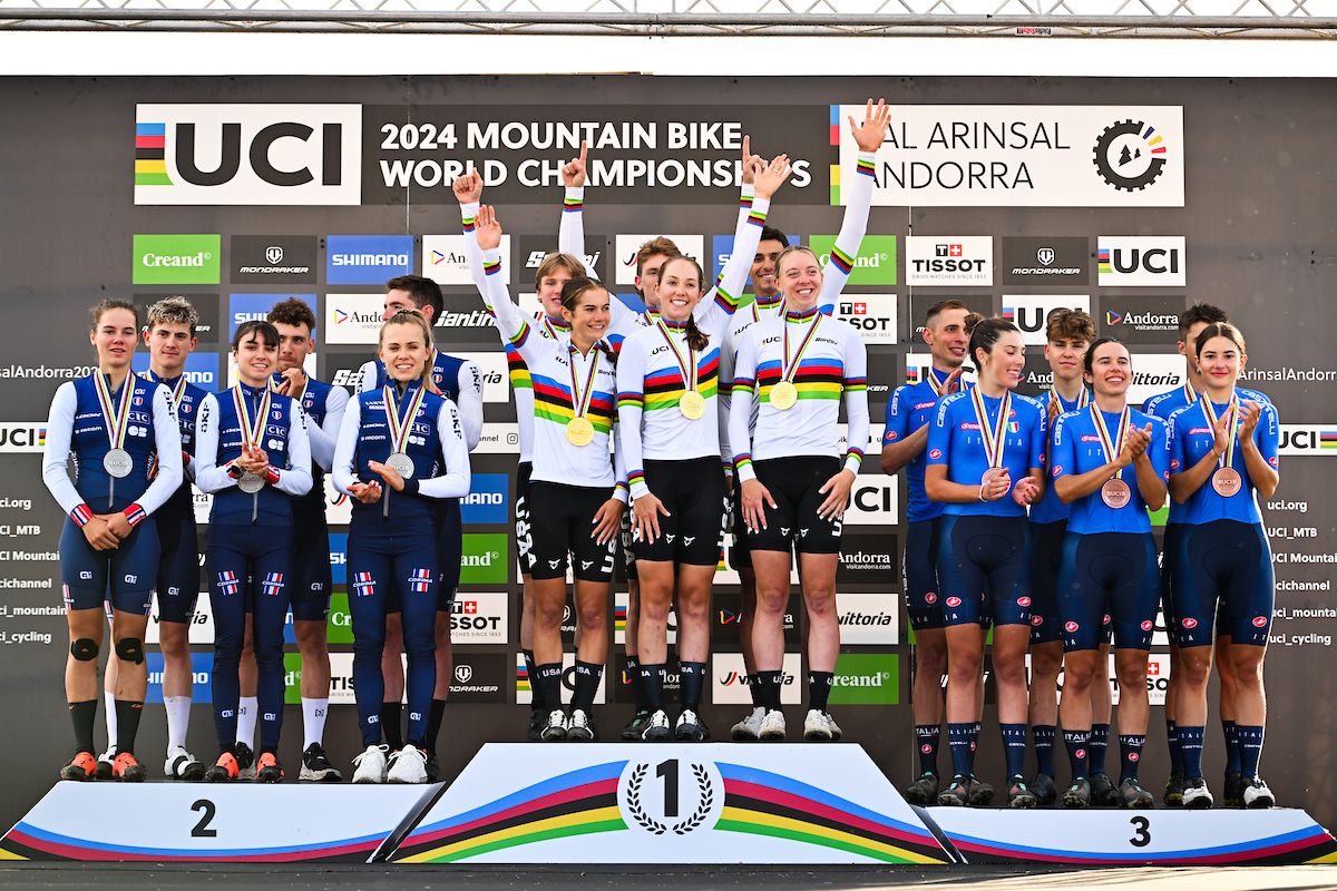 Picture by Will Palmer/SWpix.com - 28/08/2024 - Cycling - 2024 UCI Mountain Bike World Championships - Pal Arinsal, Arinsal, Andorra - Mixed Team Relay Podium - Brayden Johnson (USA), Nicholas Konecny (USA), Haley Batten (USA), Vida Lopez de San Roman (USA), Madigan Munro (USA), Christopher Blevins (USA) receiving the Gold Medal with Luca Martin (France), Nicolas Kalanquin (France), Loana Lecomte (France), Olivia Onesti (France), Anais Moulin (France), Mathis Azzaro (France) receiving the Silver Medal and Luca Braidot (Italy), Matteo Siffredi (Italy), Martina Berta (Italy), Giada Martinoli (Italy), Valentina Corvi (Italy), Mattia Stenico (Italy) receiving the Bronze Medal