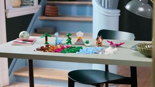 Lego Creative Dinosaurs laid out on a green table