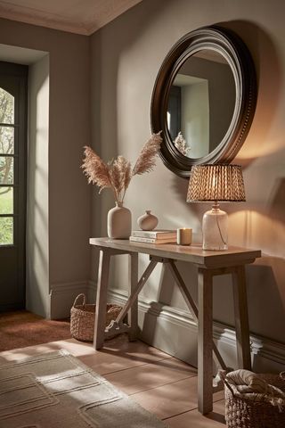 hallway with console table and mirror