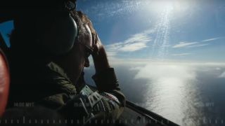 A pilot looking for signs of wreckage in MH370: Mystery of the Lost Flight