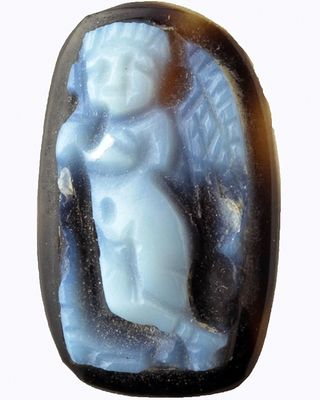 In their excavations the archaeologists found artifacts that reveal the wealth the inhabitants of the mansion enjoyed, including this gem depicting Cupid holding a torch.