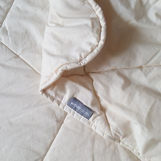 The Woolroom Deluxe Washable Wool Duvet being tested on a bed