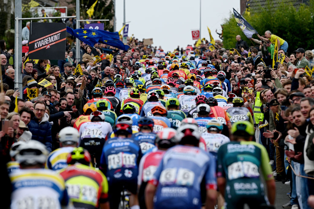 OUDENAARDE, BELGIUM - MARCH 31: A general view of the peloton climbing to the Berendries hill while fans cheer during the 108th Ronde van Vlaanderen - Tour des Flandres 2024 - Men&amp;apos;s Elite a 270.8km one day race from Antwerpen to Oudenaarde / #UCIWT / on March 31, 2024 in Oudenaarde, Belgium. (Photo by Dario Belingheri/Getty Images)