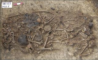 The grave in Koszyce, southern Poland, holds the remains of 15 people and the grave goods that were buried with them.