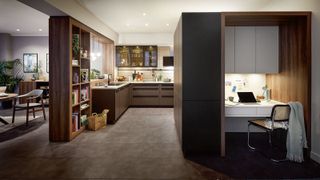 A kitchen with a built-in office space to the right