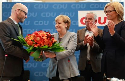 Angela Merkel wins a fourth term
