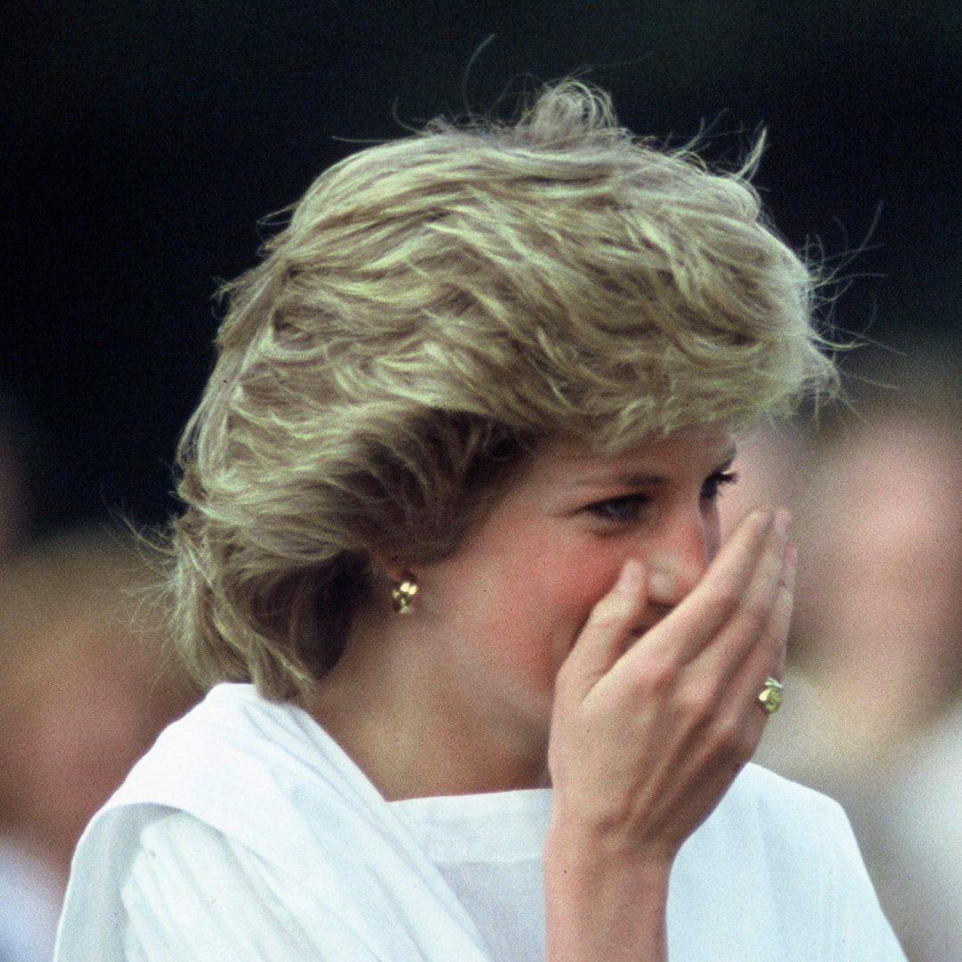Princess Diana laughing and covering her mouth