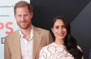Prince Harry, Duke of Sussex and Meghan, Duchess of Sussex pose at the IGF Reception during day two of the Invictus Games
