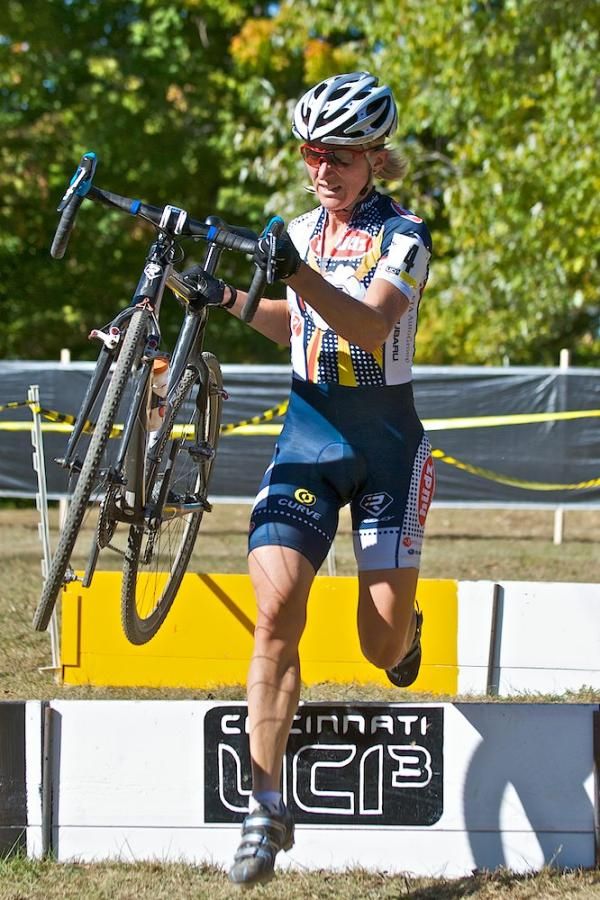 Second Place international woman Sue Butler prepares to remount after crossing the barriers. The barriers were 16&rdquo; high and placed about 5 yards after a hairpin corner, one of the few flat corners on the course. Butler is from Oregon and races for team Hudz/Subaru