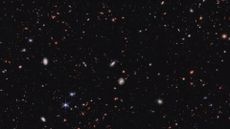a deep-sky image showing hundreds of distant galaxies