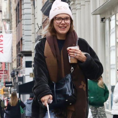 Millie Bobby Brown walks her dog wearing a teddy coat Louis Vuitton accessories and Chloe Moon boots