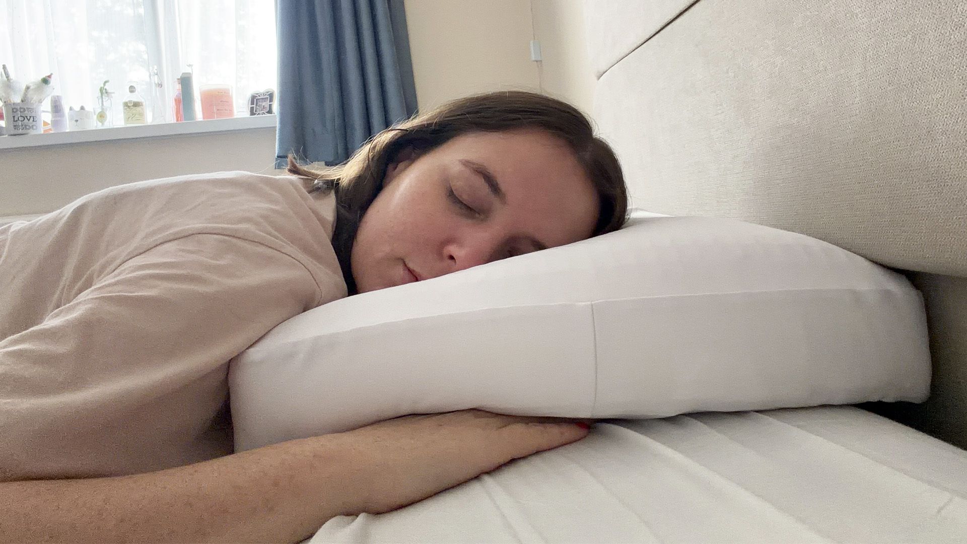 Tester Ruth Jones front sleeps on the Purple DreamLayer pillow with no booster layers