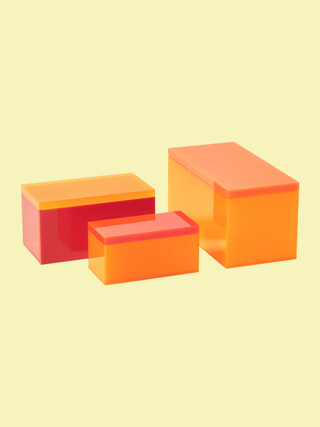 A set of three orange and yellow storage boxes