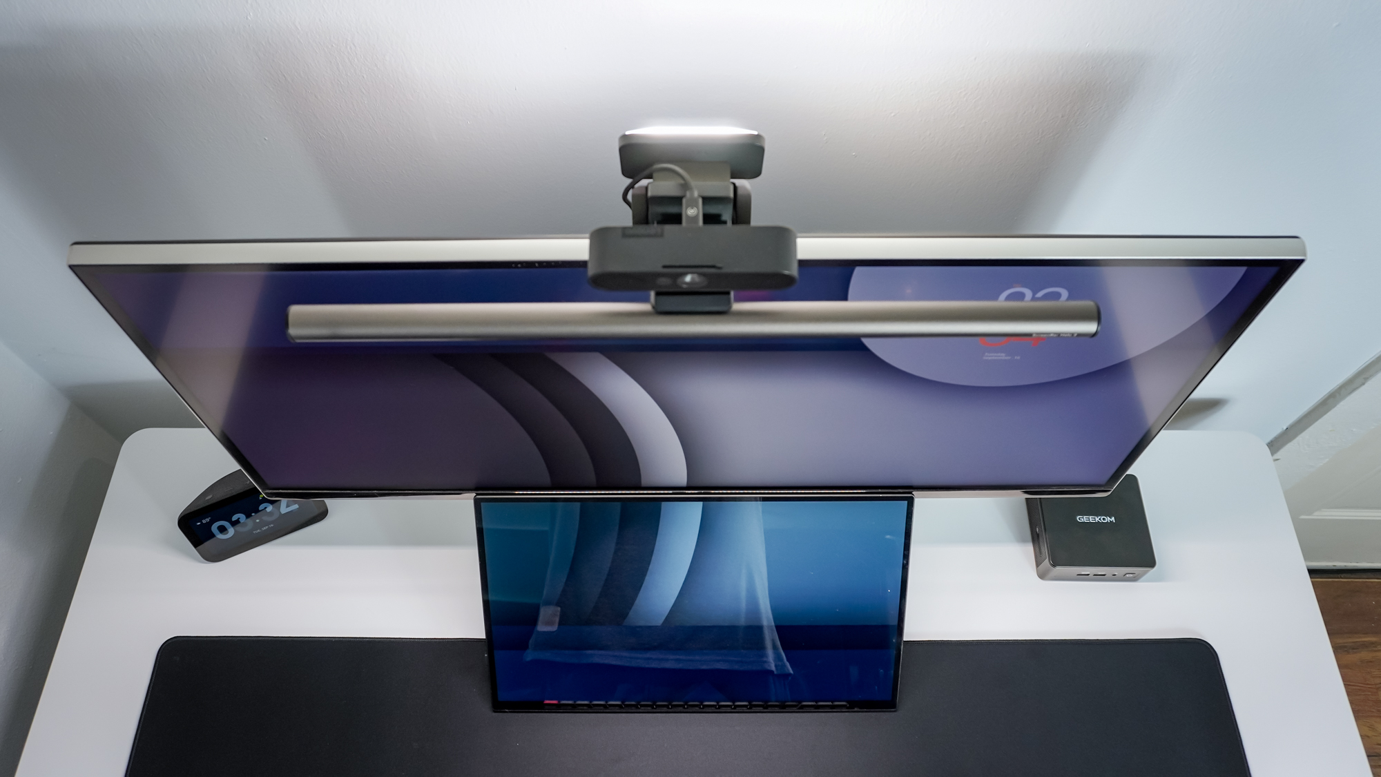 An overhead view of the BenQ ScreenBar Halo 2 monitor light bar on top of an ultrawide monitor